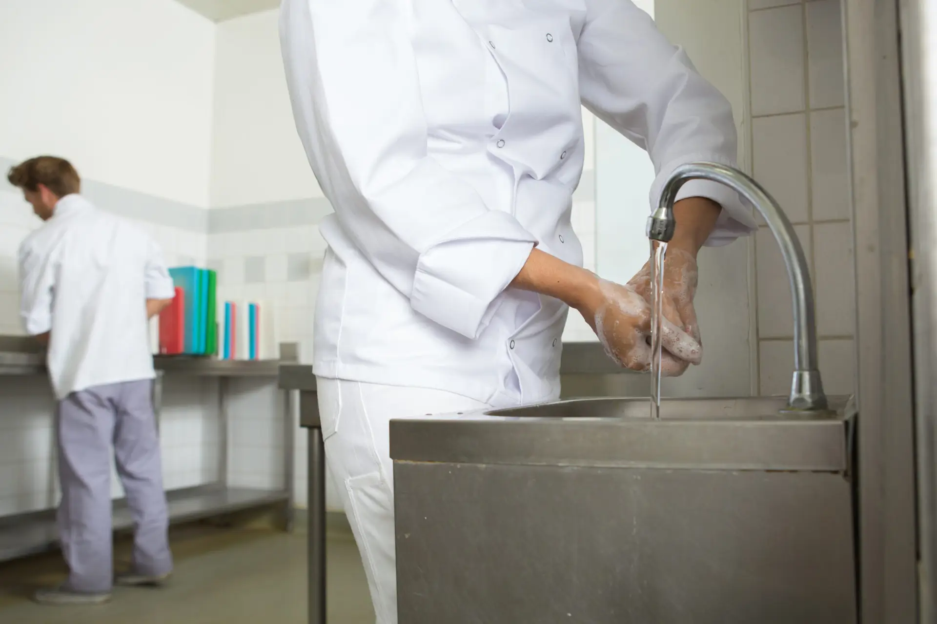 chef washing his hands prior to cook.