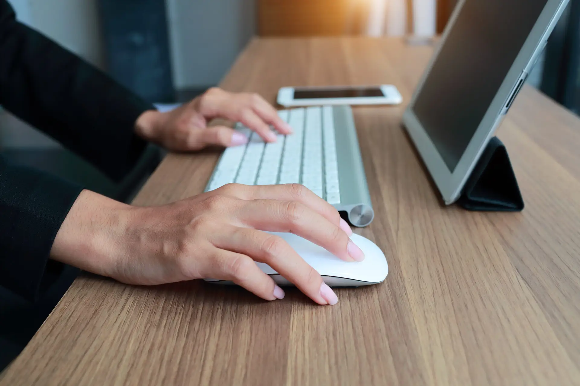 closeup businesswoman hands using smart phone and tablet